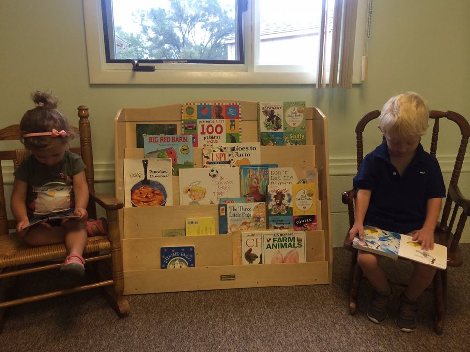 kids reading a book at a Preschool & Daycare Serving Brighton, MI