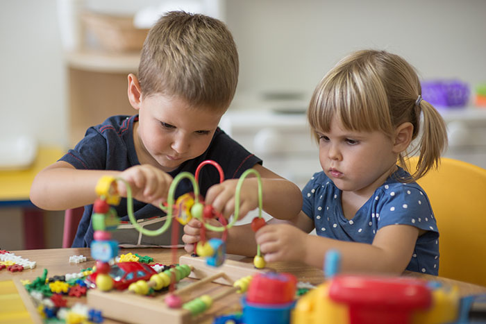 kindergarten kids playing together at a Preschool & Daycare Serving Brighton, MI