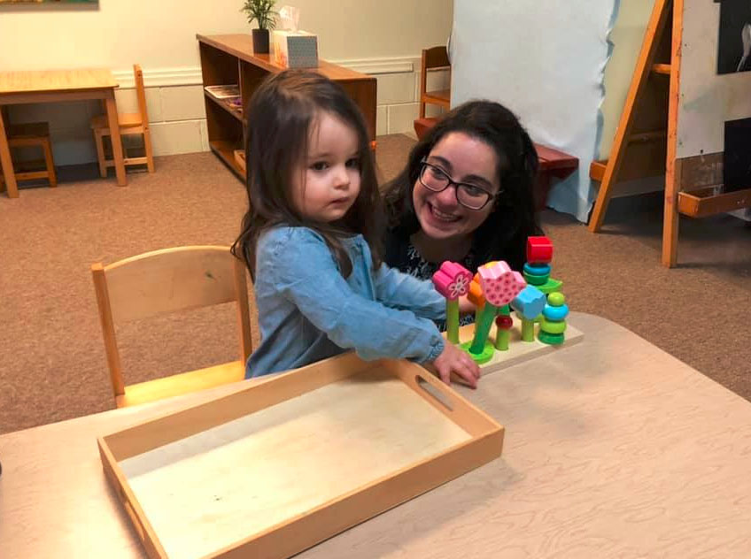 teacher and toddler playing with blocks at a Preschool & Daycare Serving Brighton, MI