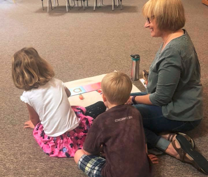 teacher with kindergarten students at a Preschool & Daycare Serving Brighton, MI